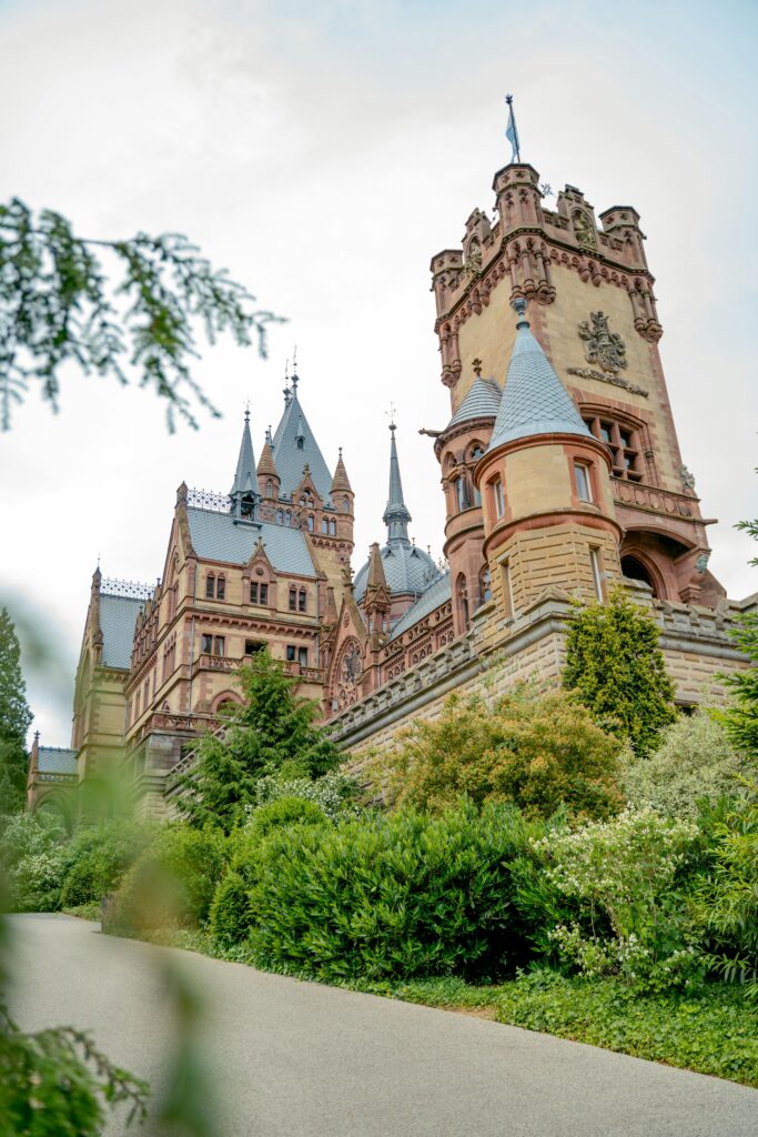 Majestic view of Drachenburg Castle with lush greenery in Königswinter, Germany.