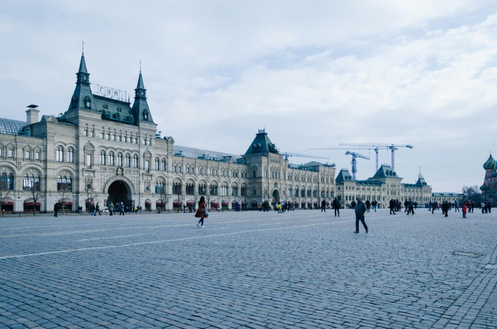 Historic GUM department store facade at Red Square under a cloudy sky, Moscow, Russia.